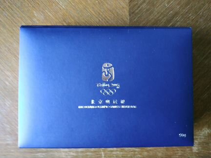 Серебряный памятный знак с талисманами Олимпиады в